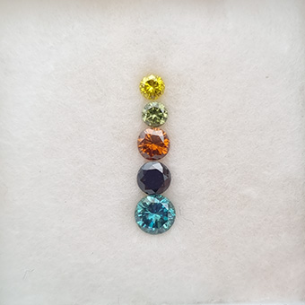 A set of treated natural diamonds of a variety of colours